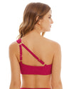 blonde woman wearing Fucsia One Shoulder Bra Top that features a beautiful cut out detail, adjustable strap for support and removable cups for shape.