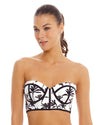 Woman wearing Black and white Underwire Bandeau Bra Top thath features removable ruffle straps and a back tie for adjustability