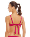 woman wearing fucsia over the shoulder bra top