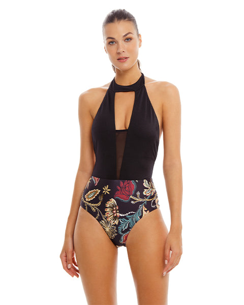 woman wearing black  High Neck One Piece features a plunging neckline with mesh panel and halter tie around the neck and a contrasting print bottom has hand beading for added style.