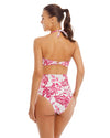 woman wearing white and fucsia Bandeau One Piece that features a bandeau top with cutout. Hand beading accentuates the print.