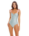 Woman wearing aReversible One-Piece that features over-the-shoulder ties with handmade beading detail at the ends. The V-wire front and inner cups create a flattering bustline. This suit has moderate bottom coverage.