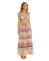 woman wearing over the shoulder top and Maxi skirt with tiered design and handmade beading at the waistband and tassels.