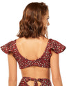 woman wearing red animal print top that features ruffle sleeves, o-ring trim and removable cups. 